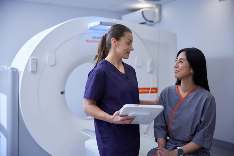 Patient being prepped for CT scan.