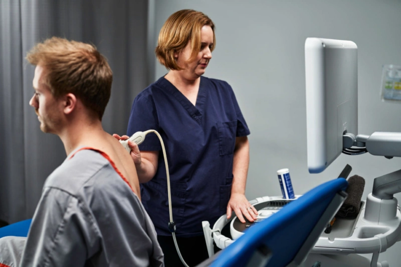 Man receiving ultrasound scan of shoulder