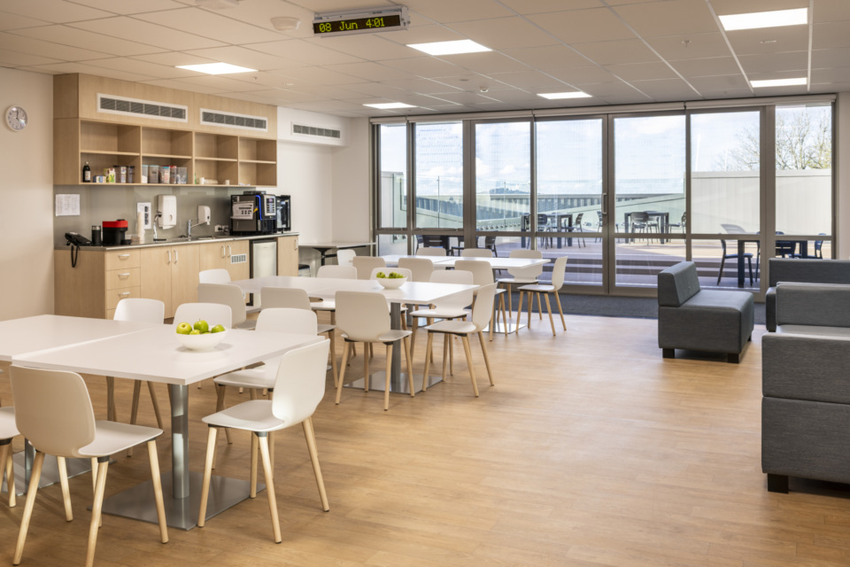 Staff tea-room, with well-equipped kitchen and top-floor deck, offering fresh air, natural light.